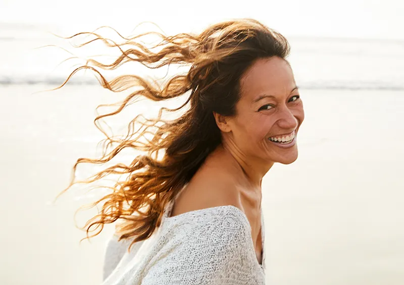 Woman smiling on the beach